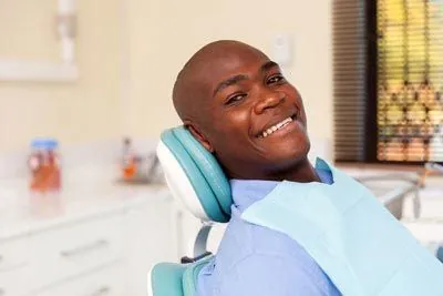 man smiling during his cosmetic dentistry procedure