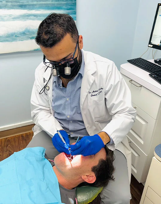 Dr. Farahat providing emergency dental care