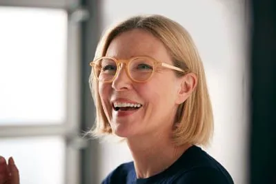 woman smiling after her restorative dental procedure