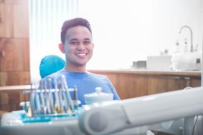 man smiling while visiting Precious Smiles Family Dentistry