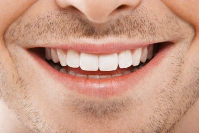 close up of a man's smile