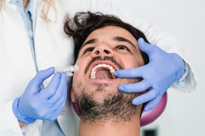 man getting Invisalign at Precious Smiles Family Dentistry
