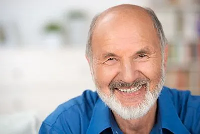 man smiling big after treatment at Precious Smiles Family Dentistry